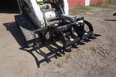 used tomahawk universal mount skid steer bucket|root bucket.